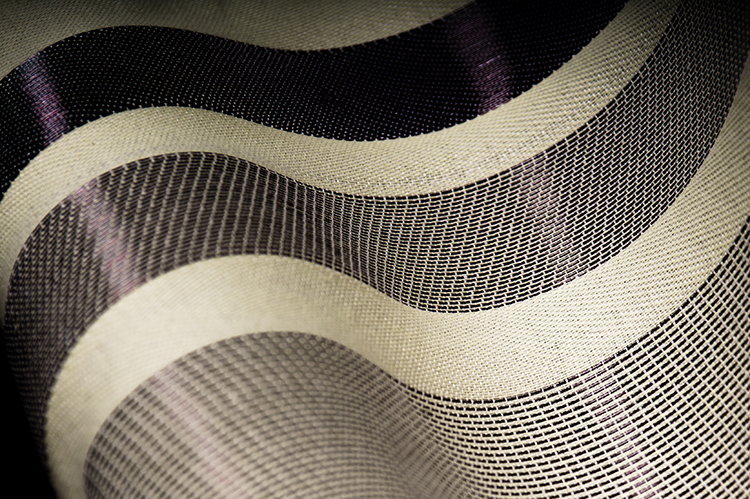 Lincoln Laboratory staff have developed a fabric that is woven with microstructured photonic bandgap polymer fibers. Fabrics like this will be transitioned into integrated systems under the Defense Fabric Discovery Center. Photo: Nicole Fandel