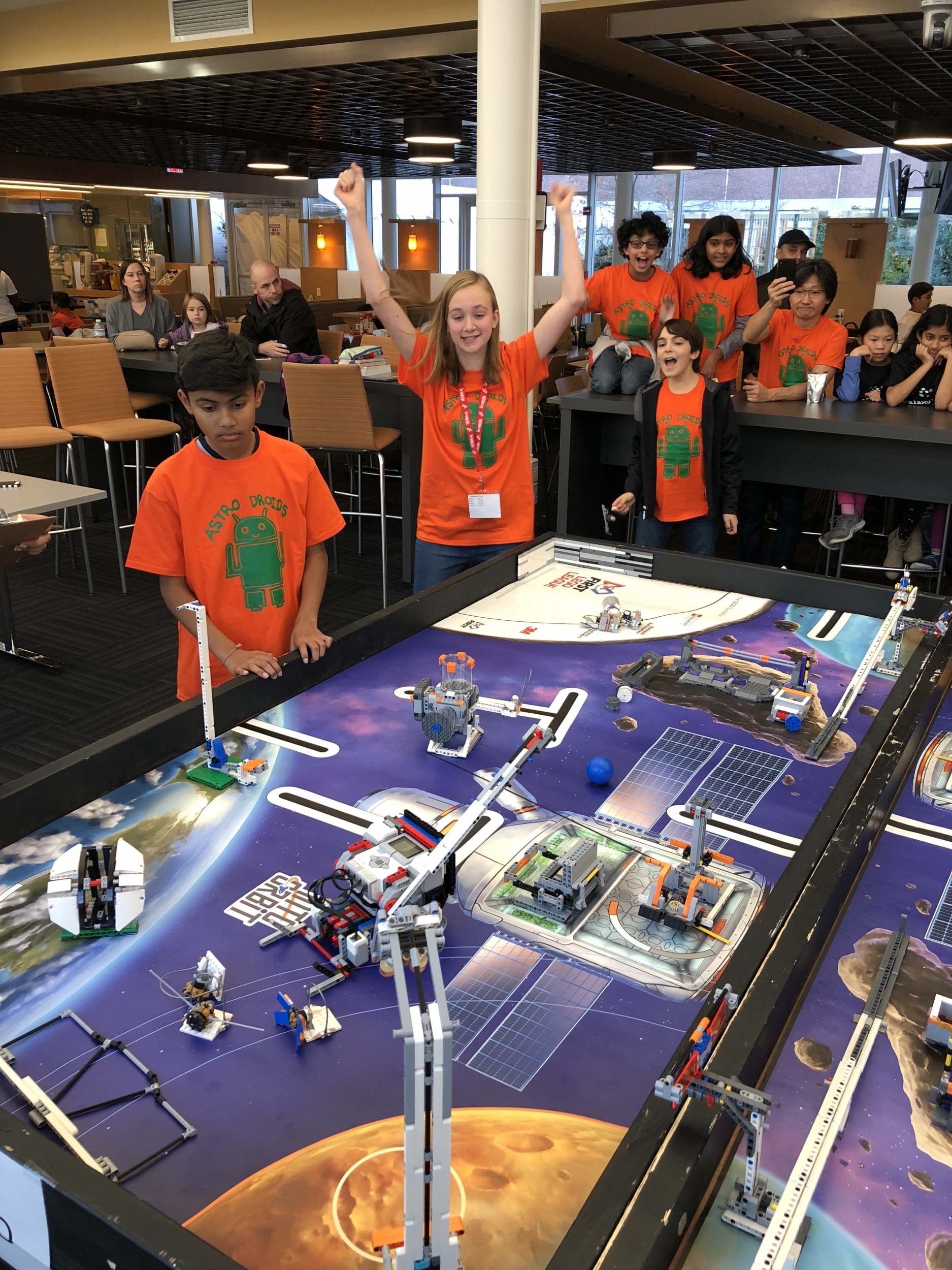 A FIRST LEGO League team strives to complete their space mission during the scrimmage using the LEGO robots they built over the fall season. Photo: David Radue