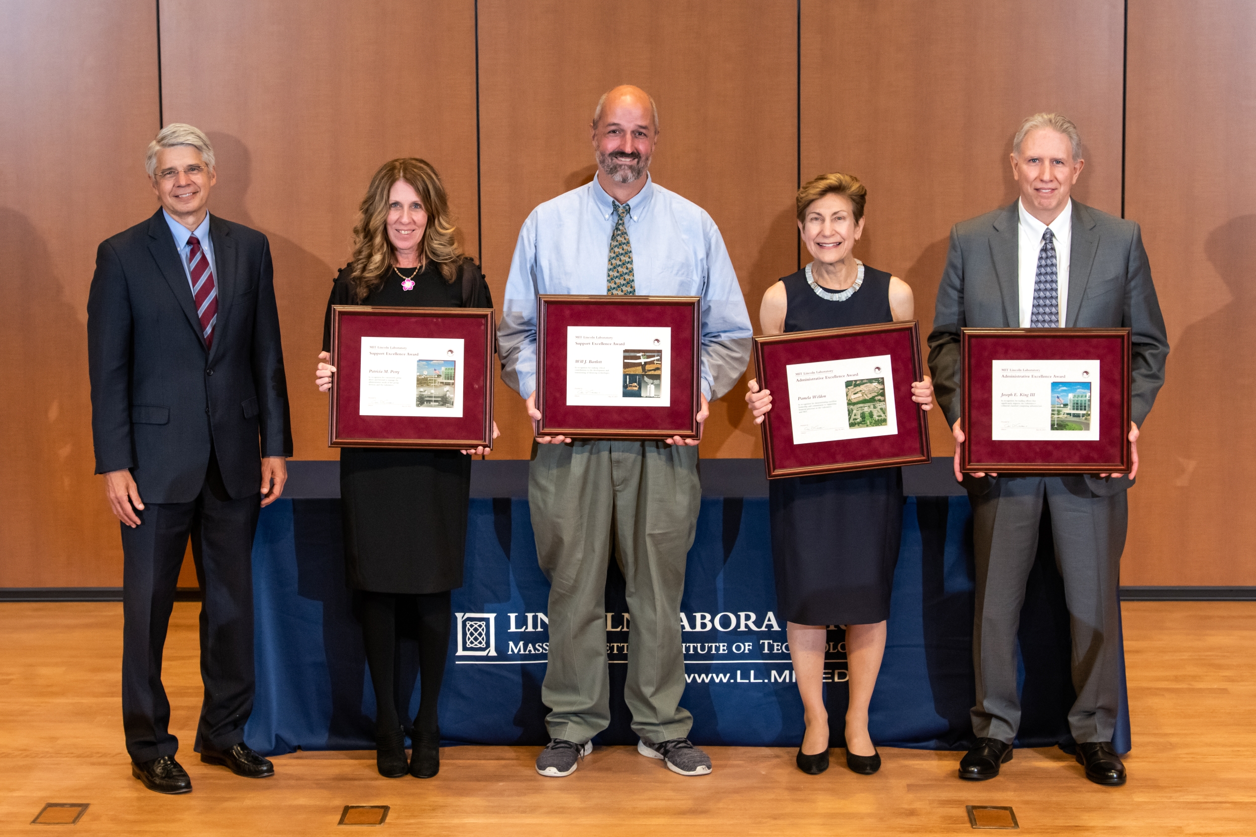 From left to right: Lincoln Laboratory Director Eric Evans and award winners Patricia Perry, Will Bartlett, Pamela Weldon, and Joseph King gathered for a photo at the Administrative and Support Excellence Awards ceremony.