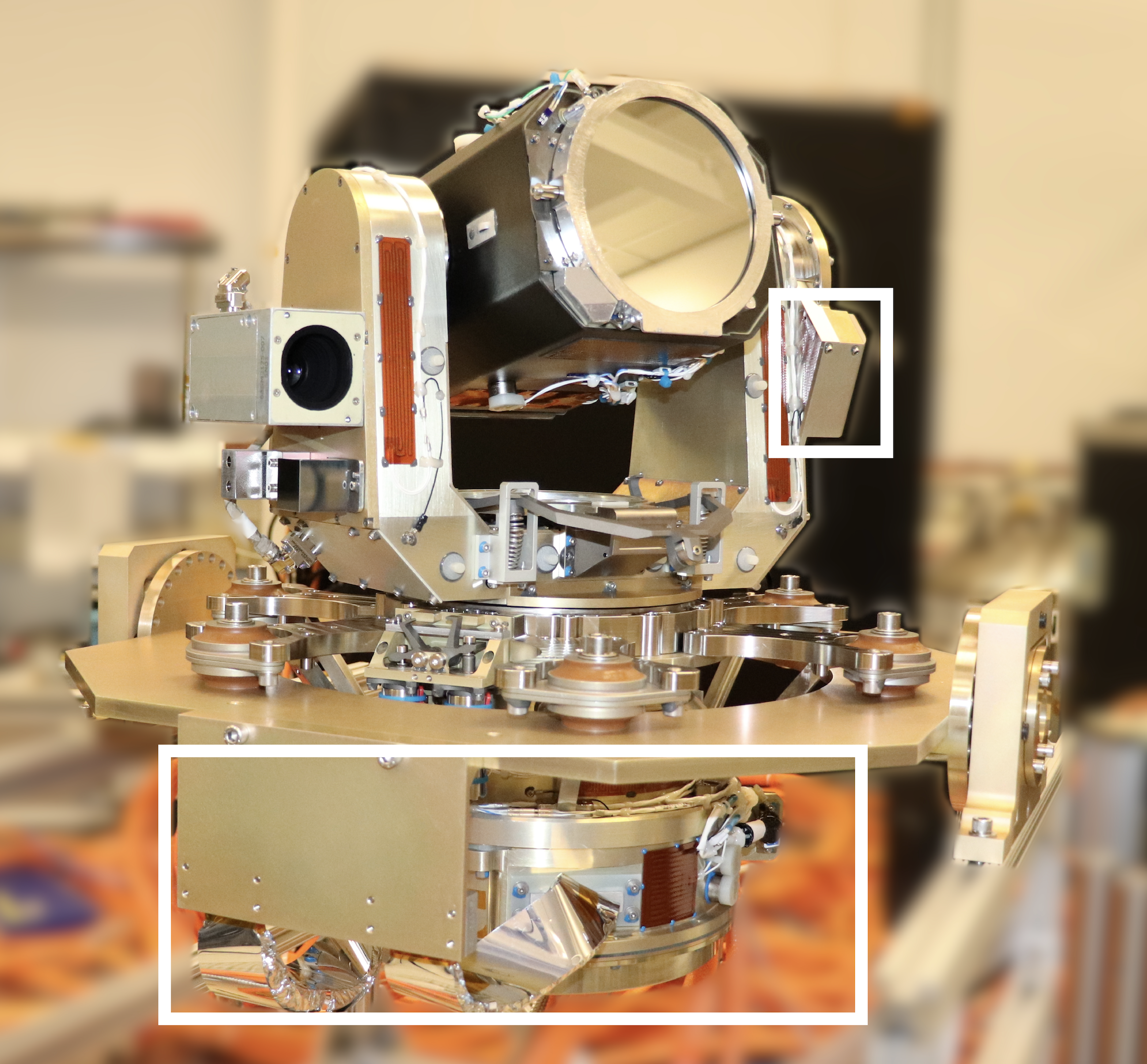 An optical module with white boxes outlining where the gimbal and backend optical assembly components are located. 