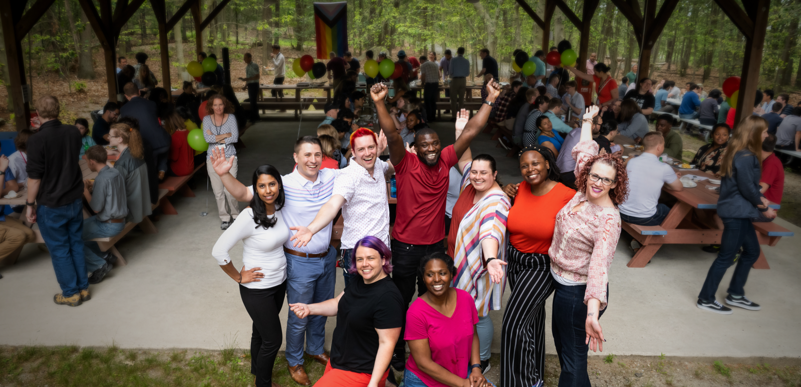 Members of LLOPEN gather for a photo at the LL Pride event.