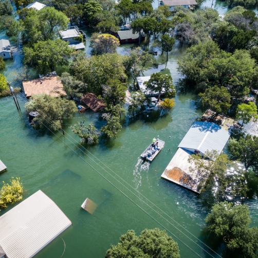 An overhead image of a neighborhood inundated with water.