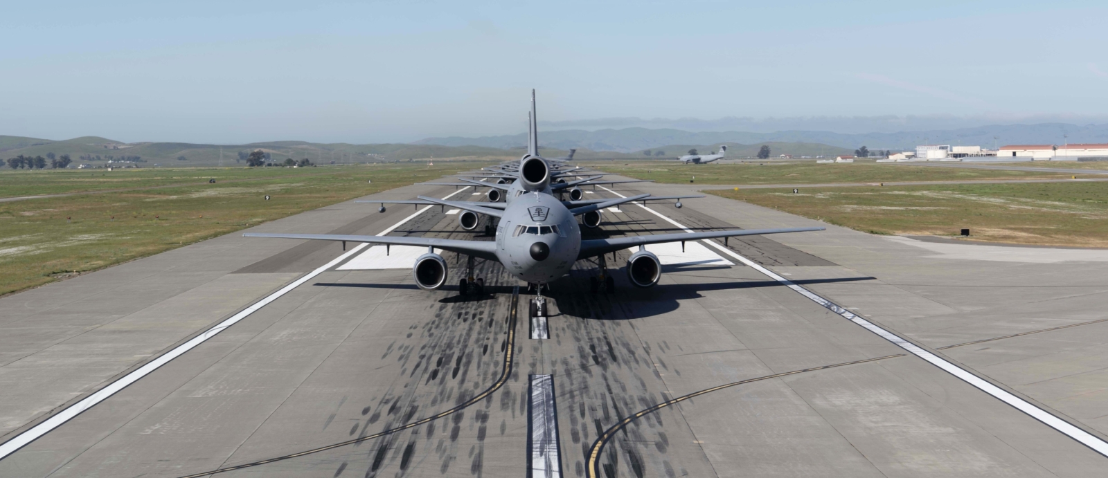 a photo looking of an airplane on an airport runway/ 