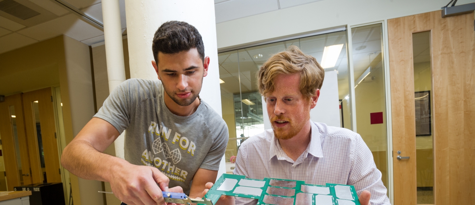 The Lincoln Scholars Program allows full-time graduate study at a local university. Above, the scholars attach panels to Boston University's first CubeSat and continue their Laboratory work in satellite aerodynamics.