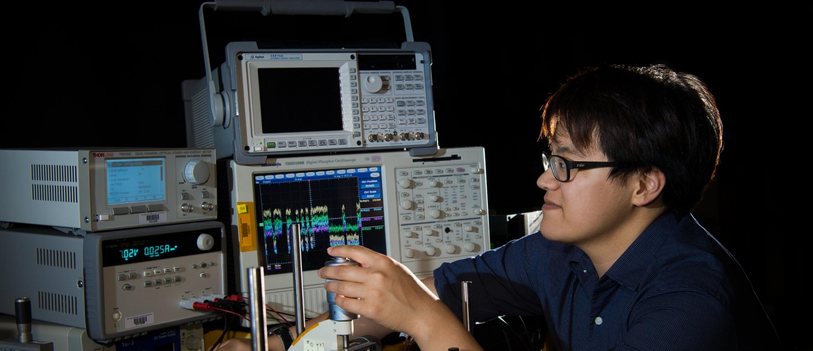 MIT 6-A student Jesse Chang aligns a narrow laser beam on a quad-cell photodetector in preparation for a direct-to-Earth optical communications uplink.