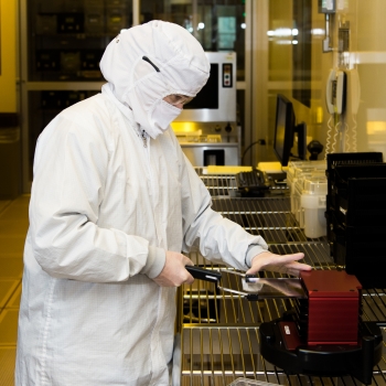 A staff member fabricates a wafer in the Microelectronics Laboratory. 