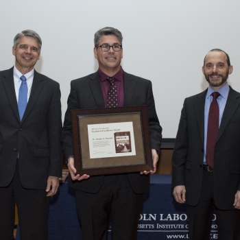 Eric Evans, left, Director of Lincoln Laboratory, presented Douglas Reynolds, center, with his award; Marc Zissman, right, Associate Head, Cyber Security and Information Sciences Division, introduced Reynolds at the awards ceremony. Photo: Glen Cooper