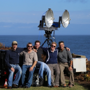 Lincoln Laboratory researchers are pictured with the front end of the polarimetric radar they assembled largely from commercial off-the-shelf components. They used the radar to collect a sea clutter dataset on the coast of Massachusetts’ Cape Ann.