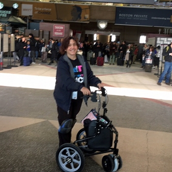 Lora Brugnaro is pictured at North Station with her improved walker.