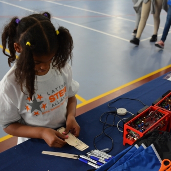 A student builds a model plane to test the LLRISE radar.