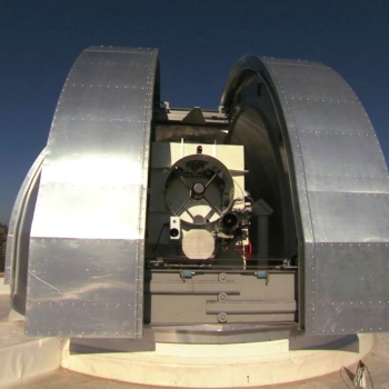 A large metal dome encloses a one-meter telescope, which is part of a ground station for laser communications. 