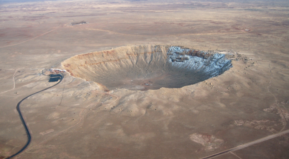 The Meteor Crater near Winslow, Arizona, is approximately 3,397 feet (0.75 miles) in diameter and 558 feet deep. It resulted from an asteroid impact 50,000 years ago. Photo courtesy of NASA