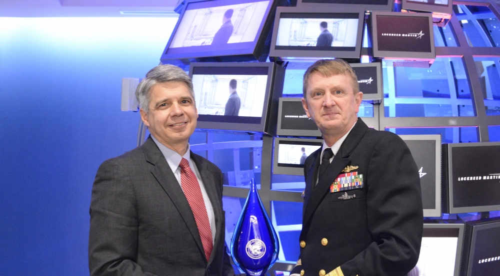 Eric Evans, director of Lincoln Laboratory, left, receives the Aegis Ballistic Missile Defense Pathfinder Award from Rear Admiral Johnny Wolfe.