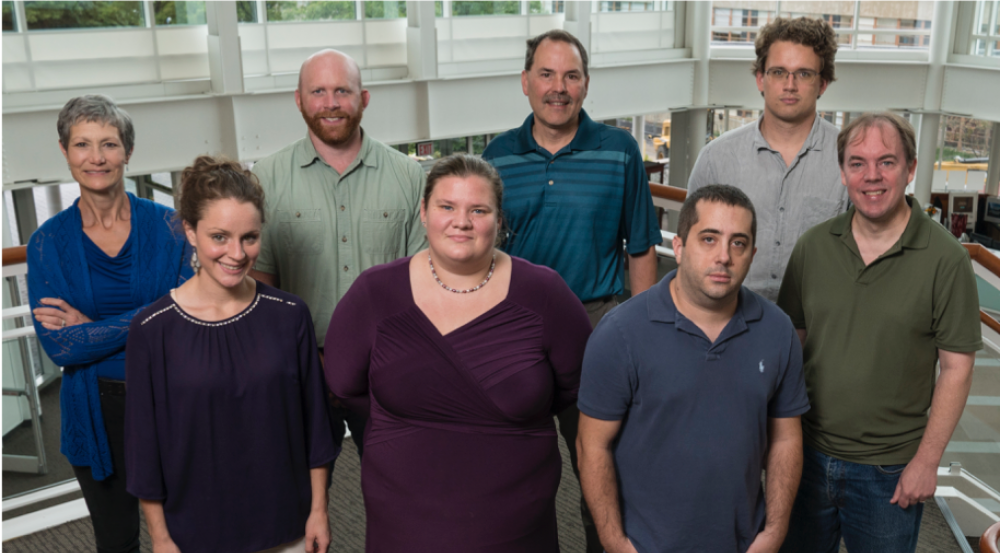 Ricke worked with the bioinformatics team to develop the IdPrism system: back row, Martha Petrovick, Philip Fremont-Smith, Darrell Ricke, and James Watkins; front row, Mallory Clark, Sara Stankiewicz, Adam Michaleas, and Thomas White. Photo: Glen Cooper