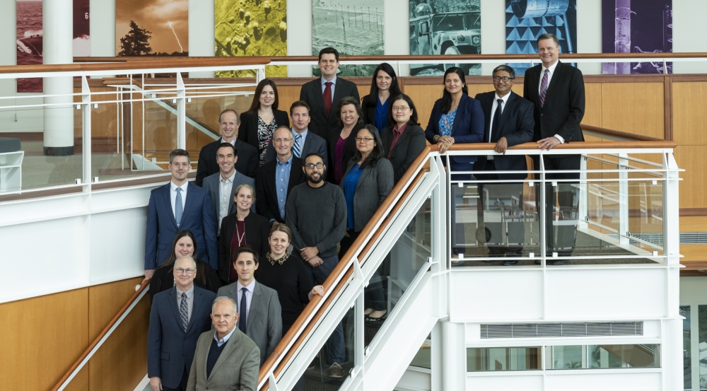 The organizing committee for the RAAINS workshop poses for a photo in the Laboratory’s lobby.