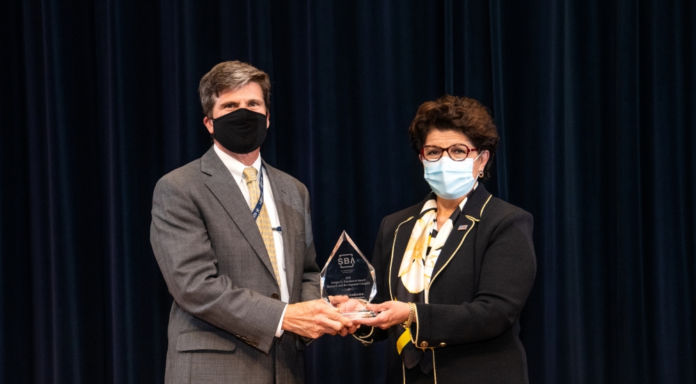 Jovita Carranza, the 26th Administrator of the U.S. Small Business Administration, presents the Dwight D. Eisenhower Award for Research and Development to Scott Anderson, Assistant Director for Operations. Photo: Nicole Fandel