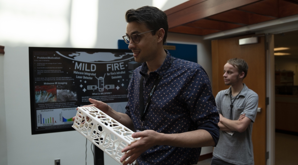 Brad Ratto, an intern in the Intelligence, Surveillance, and Reconnaissance (ISR) Systems and Architectures Group, explained MILDFIRE at the poster session held in the atrium on July 13.
