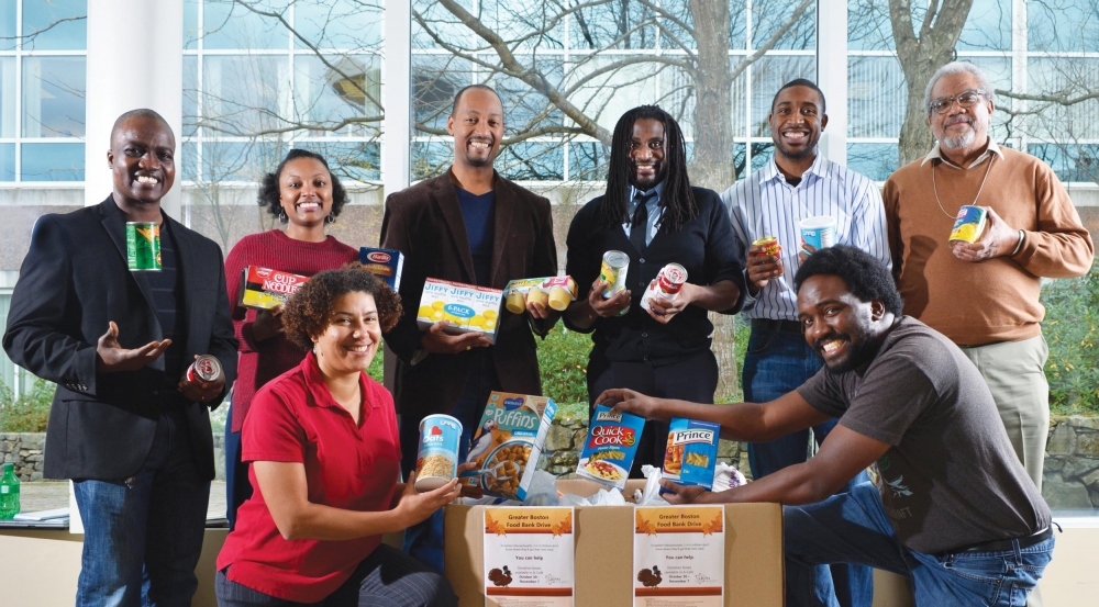 Some volunteers from the Lincoln Employees' African American Network (LEAN) gather donations prior to delivering nonperishable goods to the Greater Boston Food Bank.
