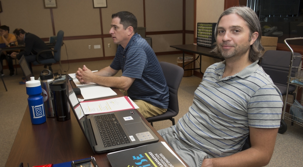 High school teachers listen to lectures and participate in hands-on building activities to construct a small radar system. 