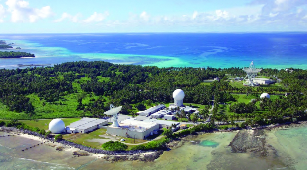 A photograph of a suite of radars on an island. 