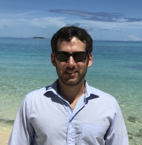 Andrew Mack in front of a beach on the Kwajalein Field Site