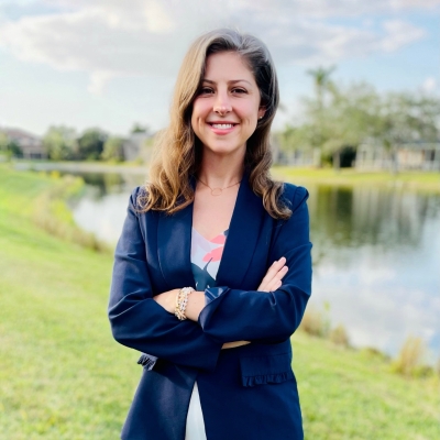 A photo of Amy Grossman standing outdoors.