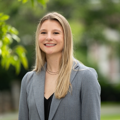 An outdoor portrait photograph of Rebecca Laher.