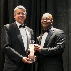 Eric Evans, left, with Brennon Marcano, right, CEO of the National GEM Consortium, accepts the leadership award at this year’s GEM Conference in Los Angeles. 
