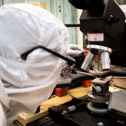 Annie Weathers measures the battery performance of a hydrogen nanobattery patterned on a silicon wafer. Photo: Nicole Fandel