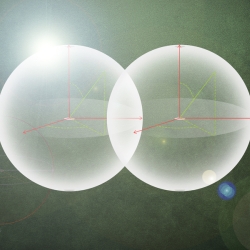 An illustration of two particles, serving as quantum bits, coming into contact.