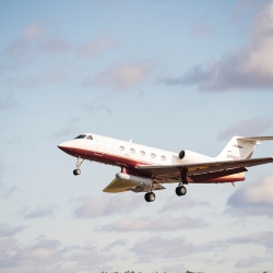 A Gulfstream III aircraft is shown with a PACECR communications pod attached.