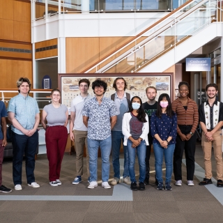 MMIP interns stand for a photo in the Lincoln Laboratory lobby.