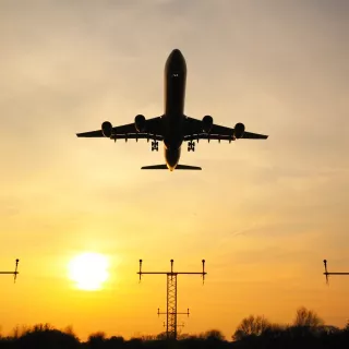 A photo of a plane taking off a runway