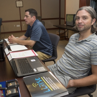 High school teachers listen to lectures and participate in hands-on building activities to construct a small radar system. 