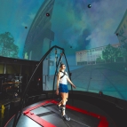 A woman, attached to a harness, stands on a treadmill, and is surrounded by a spherical screen displaying a city scene.