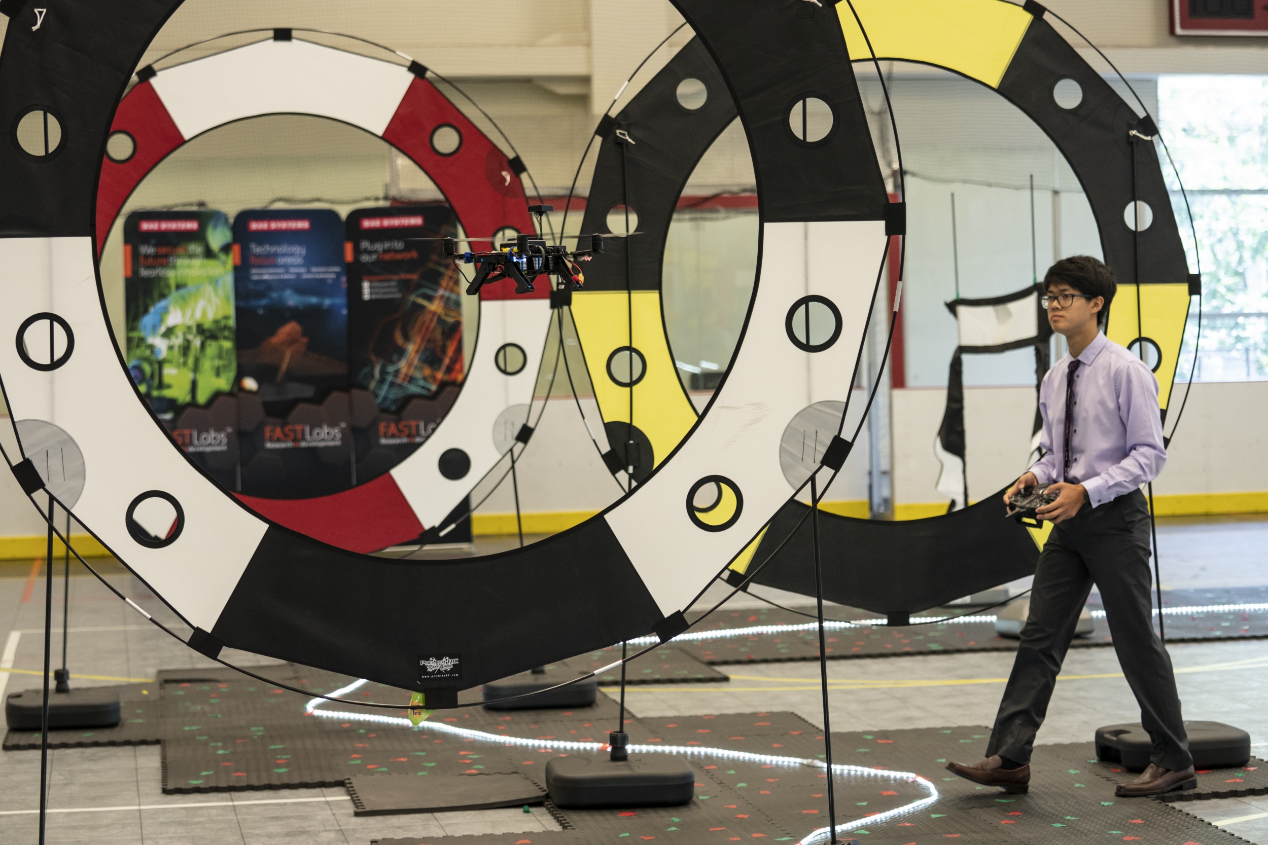 A student from the Autonomous Air Vehicle Racing class follows an Intel drone as it navigates an obstacle course. Photo: Glen Cooper