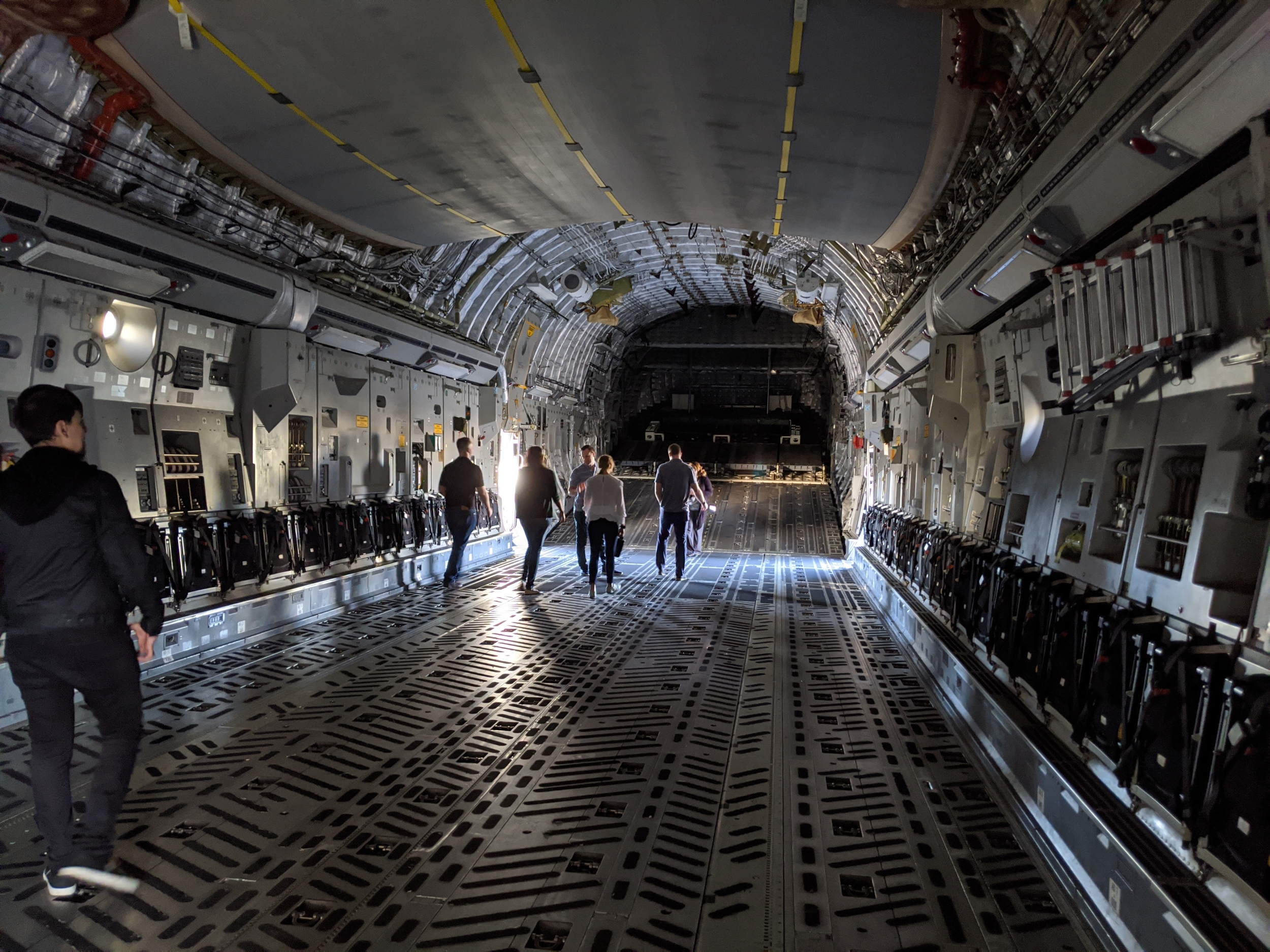 A photo of the inside of a C-17 aircraft.