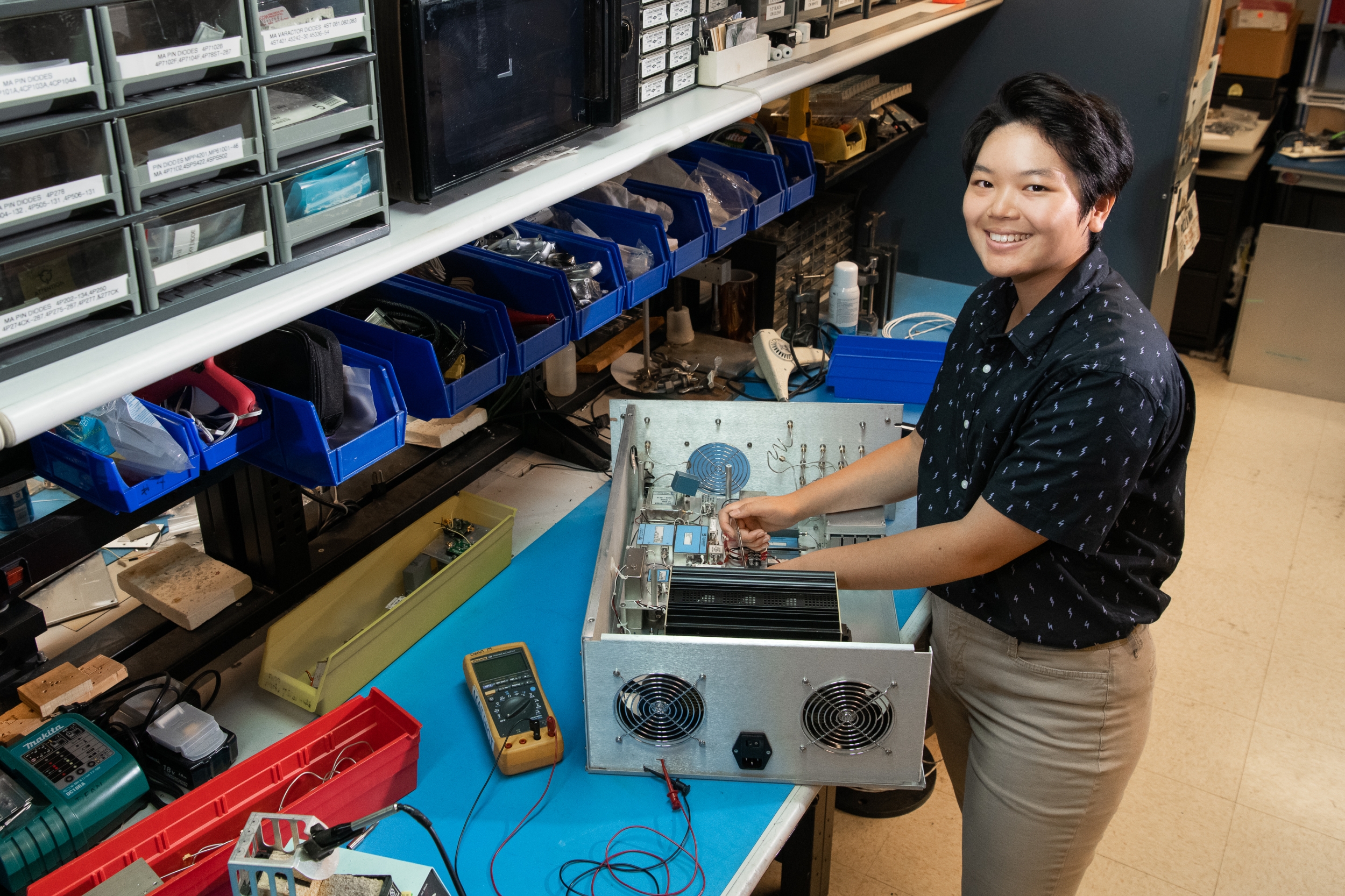 Veronica Cheng disassembles a 16-channel transmit chassis. 