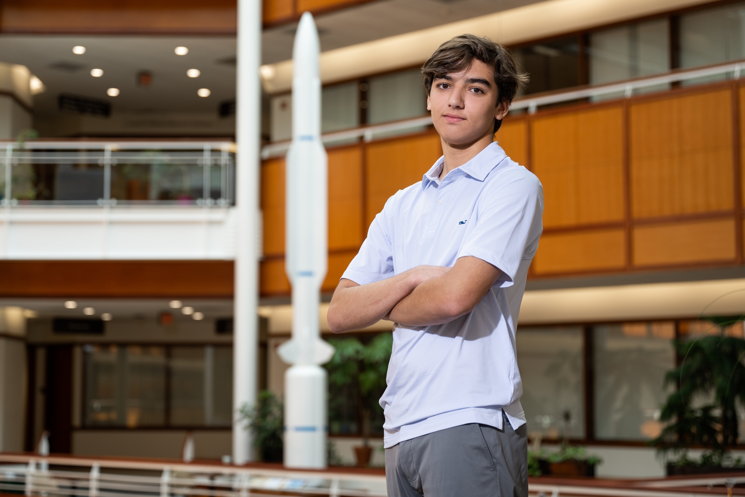 Ryan Wempen with the Standard Missile on display in Lincoln Laboratory's atrium.