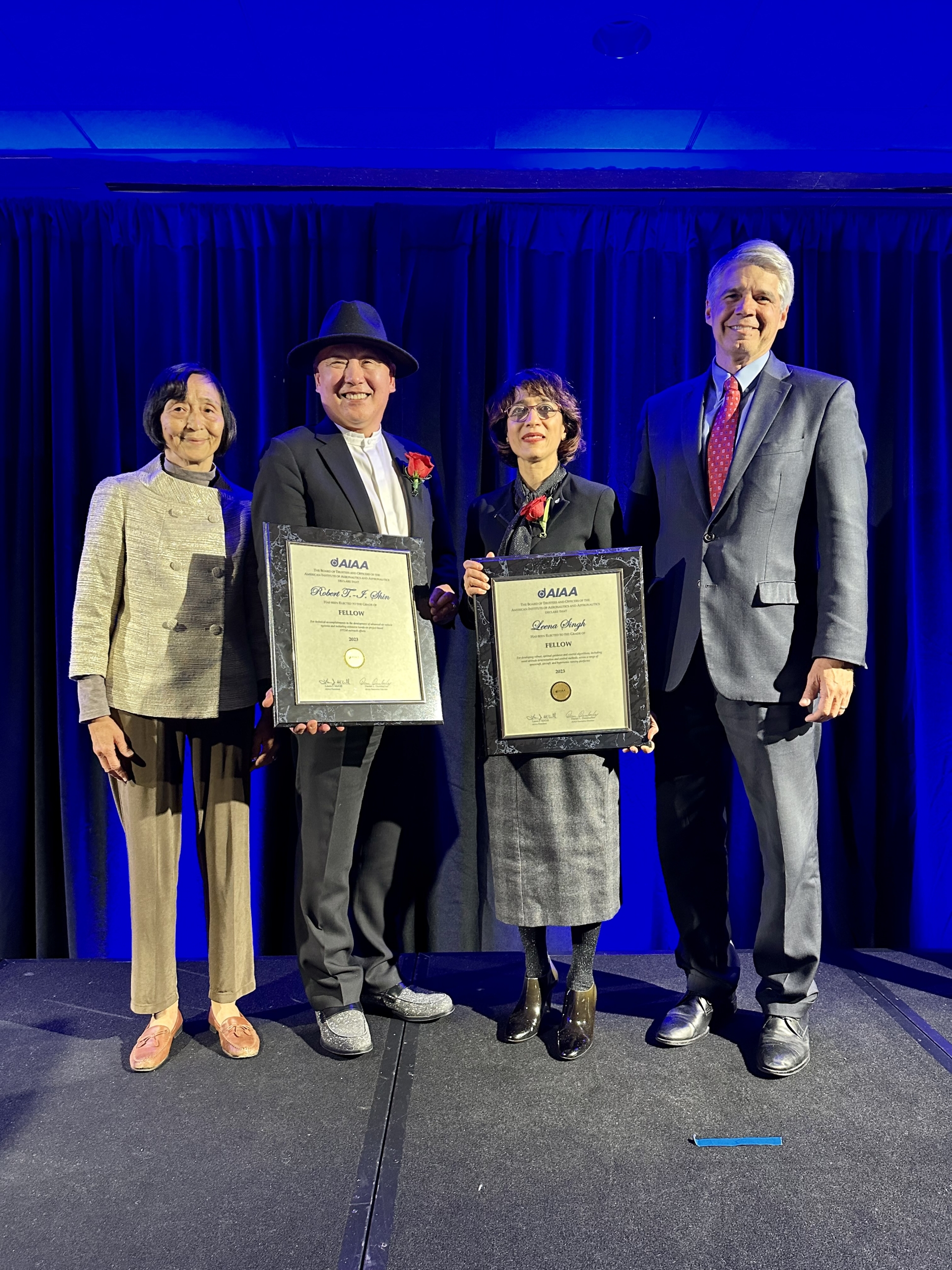 From left to right, Laboratory staff member Hsiao-hua Burke, Shin, Singh, and Laboratory director Eric Evans attend the AIAA induction ceremony.