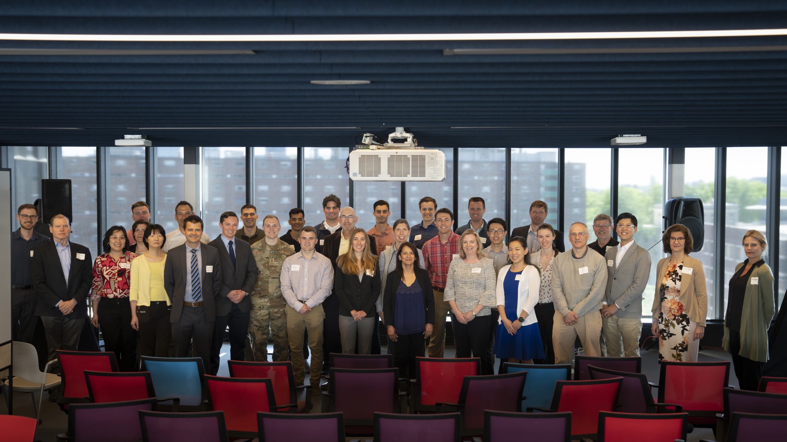Lincoln Scholars, Military Fellows, and their mentors gather for a photo at a luncheon hosted by the Lincoln Laboratory – MIT Campus Interaction Committee to highlight collaborative research.