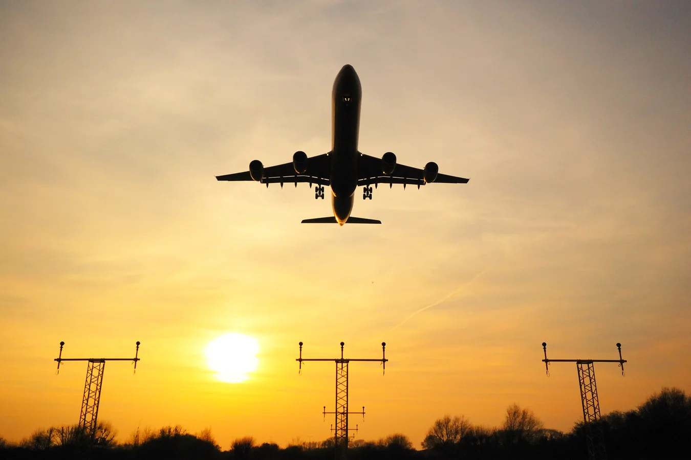 A photo of a plane taking off a runway