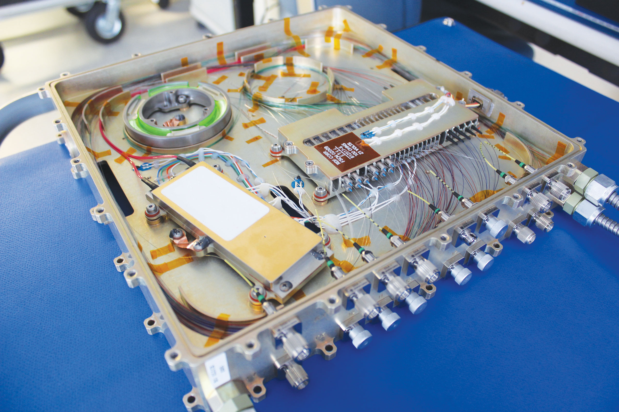 Space-qualified fiber and electro-optics hardware shown here generates and receives multi-rate DPSK waveforms.