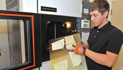 A fused deposition modeling production system in the Rapid Hardware Integration Facility enables staff to build customized thermoplastic parts for prototype systems.