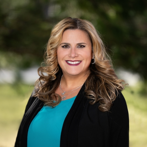 An outdoor portrait photograph of Michele Gruber.