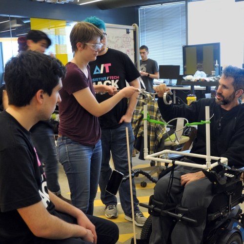 Alex Rosenberg works with his team to create a technology to play catch with his sons. Photo: MIT Assistive Technology Club Alex Rosenberg works with his team to create a technology to play catch with his sons. Photo: MIT Assistive Technology Club