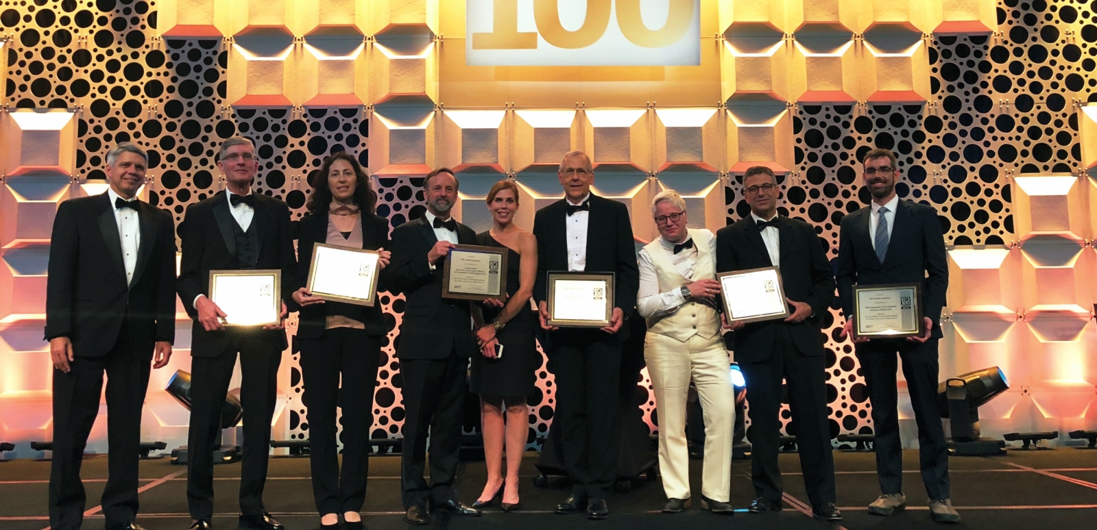 The principal researchers of Lincoln Laboratory’s ten finalists for R&D 100 Awards are seen here with Lincoln Laboratory Director Eric Evans, far left. The principal researchers for the six winning technologies display their award plaques.