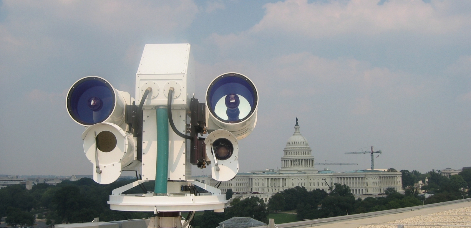 An imaging system setup on a roof with the U.S. Capitol in the background. 