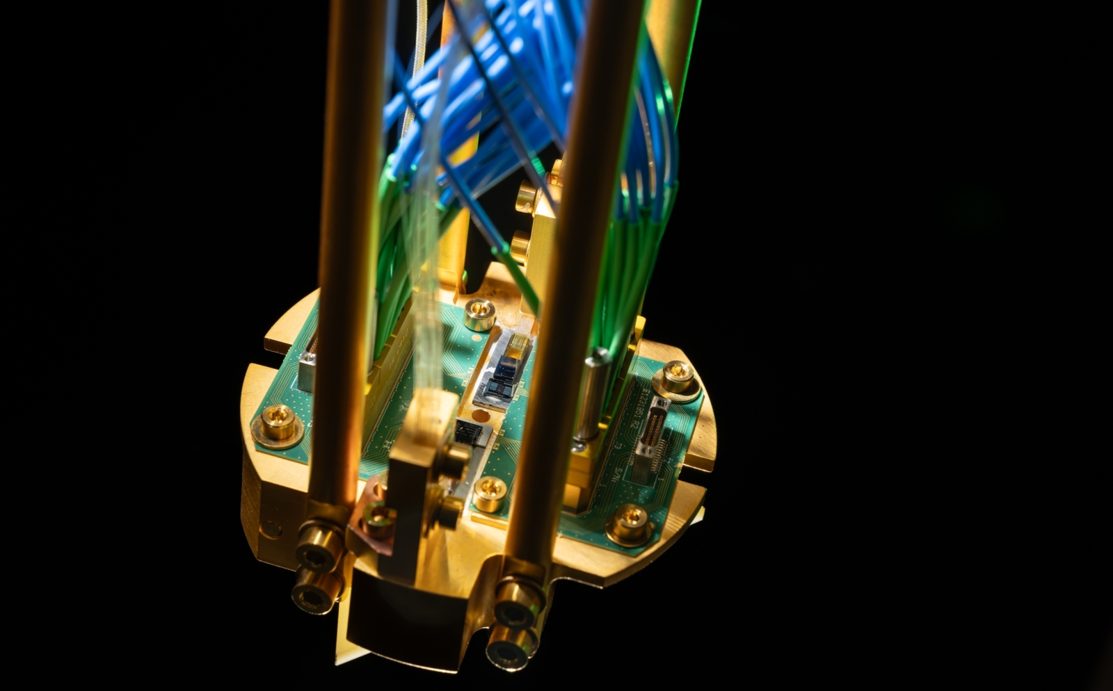 A piece of hardware showing a copper mount with integrated circuit components bonded to it