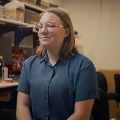 Ivy Mahncke sits in front of the camera.